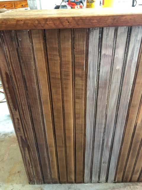 wood kitchen island showing the difference in freshly stained, unstained, and freshly applied whitewash stain