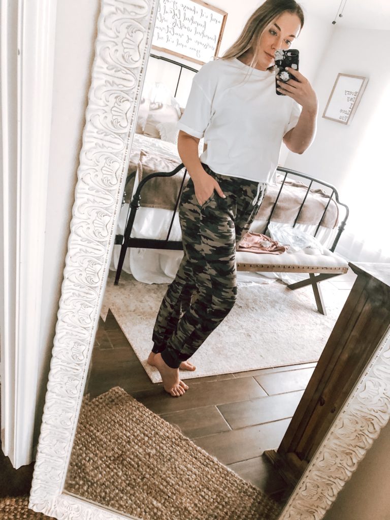 wife with a budget wearing a white crop top and camo jeggins from amazon