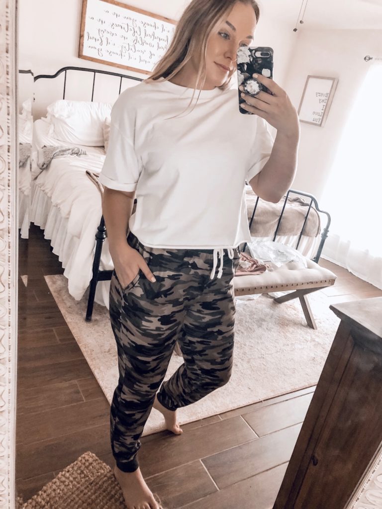 wife with a budget wearing a white crop top and camo jeggins from amazon