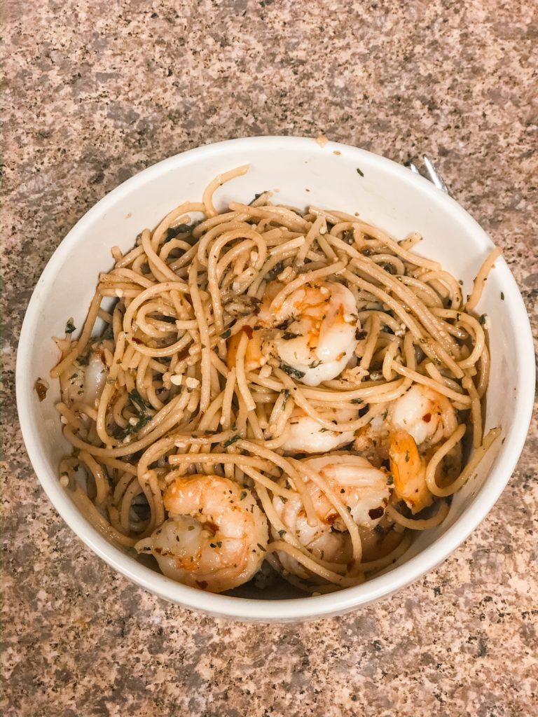 garlic shirmp pasta in a white bowl